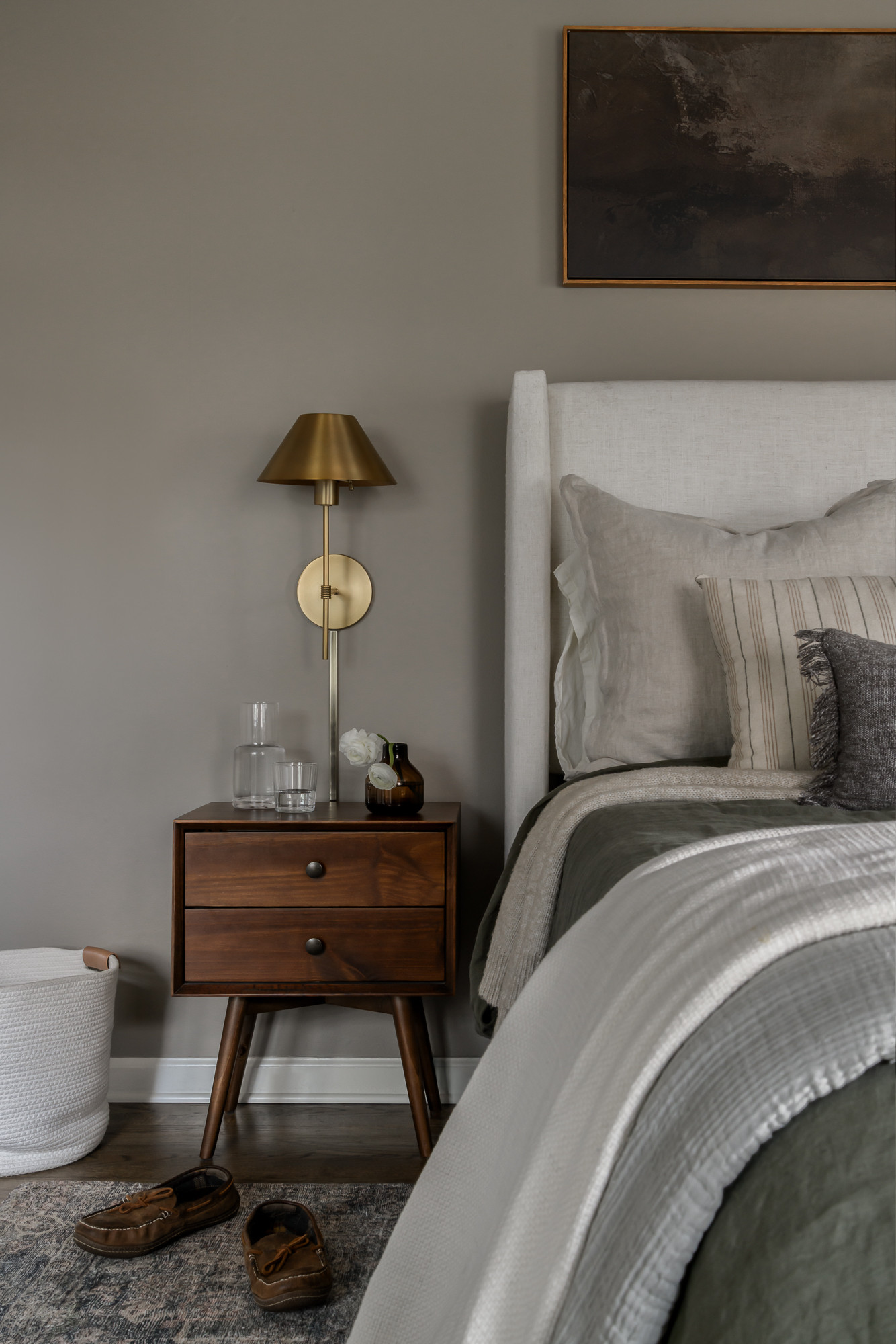 Primary bedroom with a carved antique wood bed in a colonial home tour