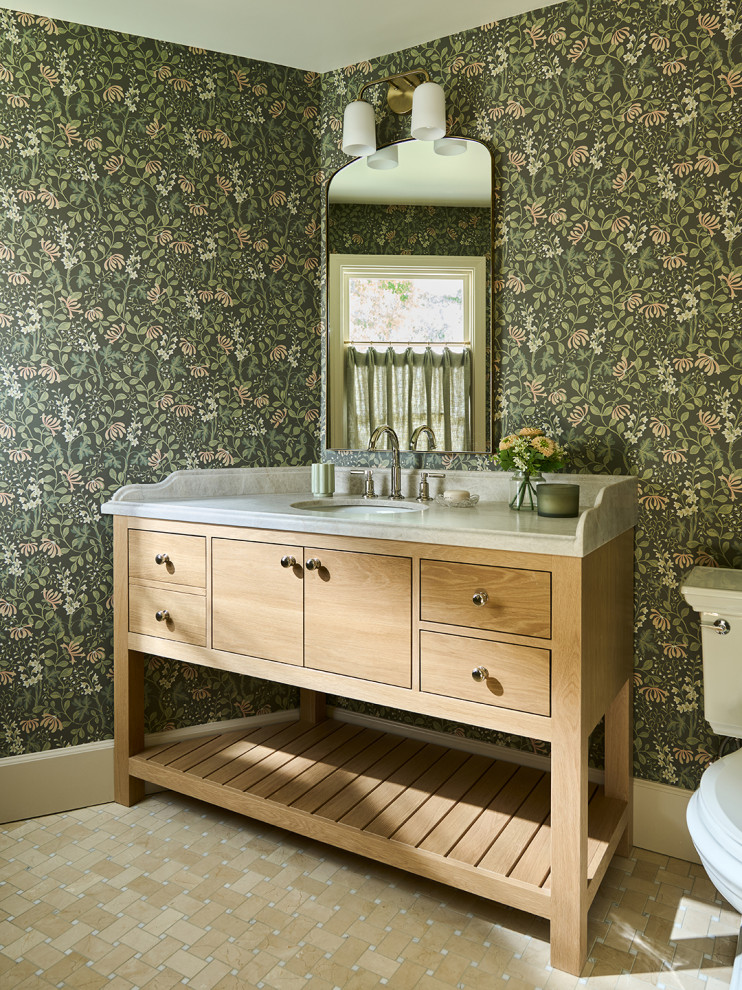 Powder room with green botanical wallpaper and a white oak vanity in a Mediterranean home tour